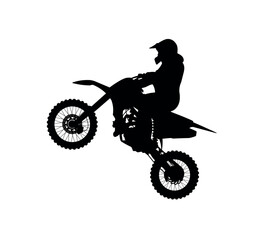 Silhouette of Motocross Rider Jumping Uphill in the Air