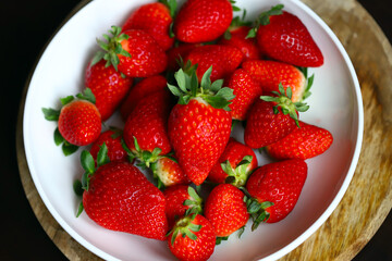 Fresh ripe strawberries in a plate.