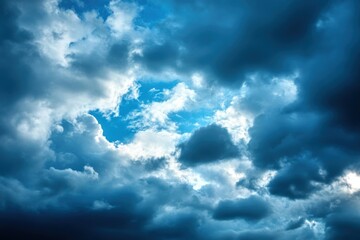 Dramatic Sky View Featuring Dark, Moody Clouds and a Glimpse of Blue Heavenly Radiance.