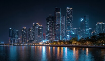 Obraz premium Cityscape lights reflect in the water at night, creating a stunning urban scene with towering buildings and a vibrant atmosphere.