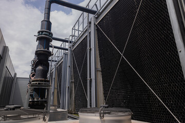 Cooling towers in data center building. Air conditioning cooling towers in front of building with...