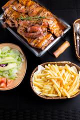 Peruvian Gastronomy, A table with a variety of food including a large plate of meat, a bowl of...