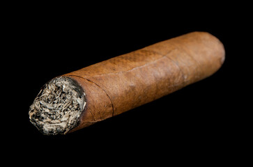Cigar isolated on black background.