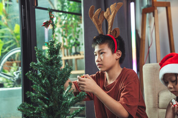Holiday Kids Decorating Christmas Tree With Beautiful Ornaments Arranging Festive Gifts Preparing Party Setup For Warm Family Celebration Tonight