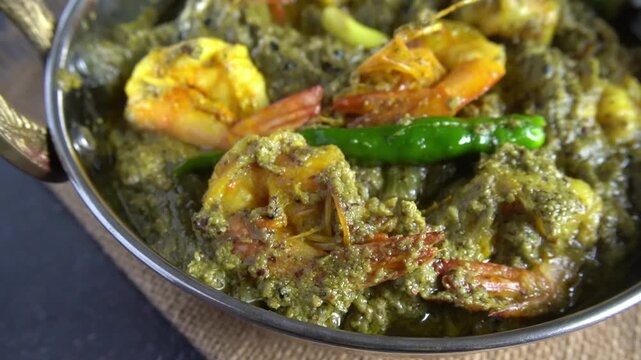 Bengali-style sapla chingri &ndash; water lily stem curry with prawns, traditional Bengali fish curry, rustic village-style cooking
