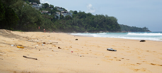 Dirty beach with garbage. Plastic trash, lots of garbage in the sand. The garbage that threw the...