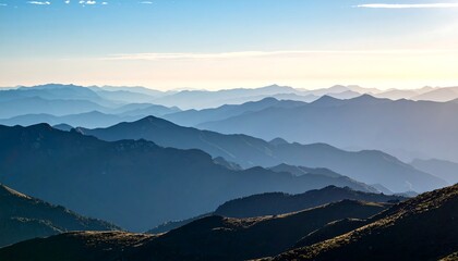 Mountain Range Layers at Sunrise Haze Blue Toned Landscape