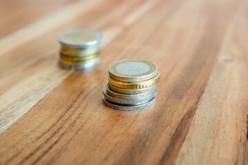 Metal coins stack. Coin money on the wood table.