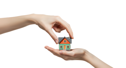 Holding small house model on palm for property or real estate