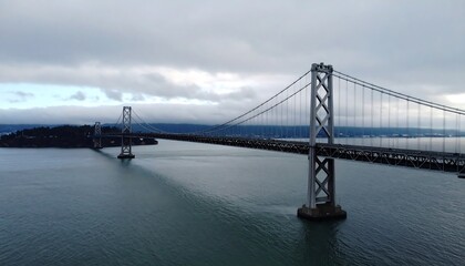 Fototapeta premium A bridge spanning a gray waterway