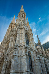 Gothic cathedral towers against blue sky

