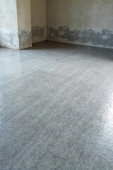 Newly poured concrete floor, smooth and gray, ready for polishing or staining Ideal for industrial, modern, or minimalist design projects Shows texture and subtle light reflection , clean, material