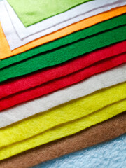 Various colors of stacked flannel fabric. Used to make handicrafts
