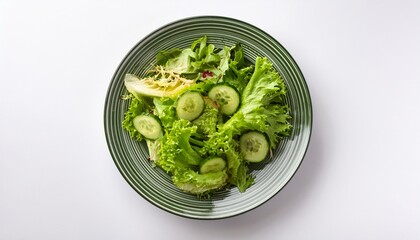 Obraz premium healthy fresh green salad plate shot from above on white background