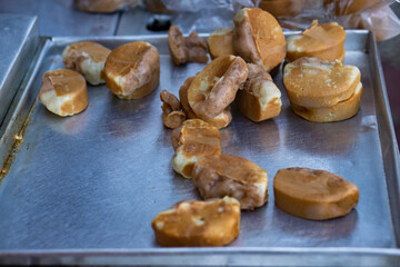 Traditional Indonesian street snack, pukis cake, freshly baked, placed on a metal tray, is ready to...