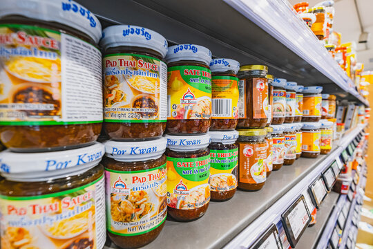  An Asian supermarket with stocked shelves of hot and soy souces