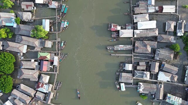 Coastal Fishing Village With Stilt Houses and Boats in North Sumatra, Indonesia, Aerial View