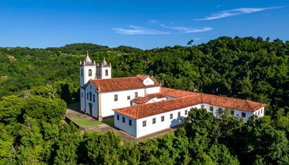Obraz premium Historic church complex nestled in lush hills
