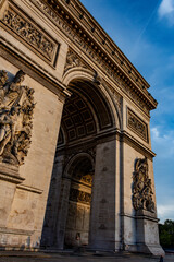 Architectural grandeur of the Triumphal Arch, illuminated by the golden hour light, showcasing its intricate details