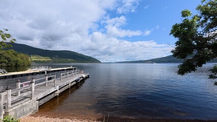 Urquhart castle overlooking Loch Ness , highland water , and the Scottish sky , landscape 