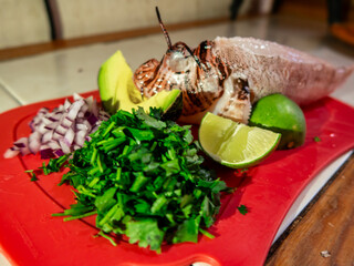 Lionfish (pterois volitans) with vegetables ready for cooking presentation