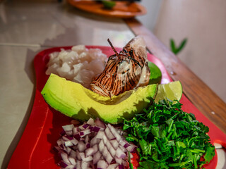 Lionfish (pterois volitans) and ingredients for ceviche presentation