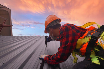 Roofer working in special protective work wear gloves,