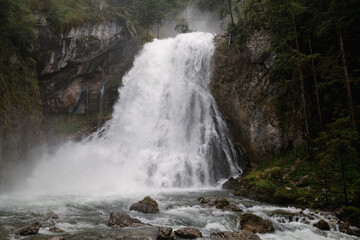 The Golling Waterfall reveals its mystical side in the rain – gentle mist surrounds the roaring...