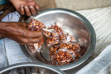 Selling street food packaged in paper