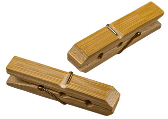 Wooden clothes pegs with metal spring isolated on a white background, perfect for laundry, drying clothes, and household use.
