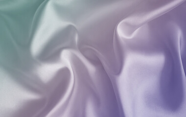 Obraz premium Light soft silk satin fabric with wavy folds. Delicate three color pastel gradient. Crumpled material. Mint green, lavender, white, mauve. Gentle bridal aesthetic. Backdrop, background, closeup.
