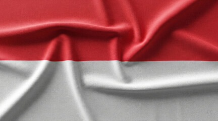 The national flag of Indonesia, Sang Saka Merah Putih, with a soft-focus effect. The fabric texture and folds symbolize patriotism, independence, and national identity.