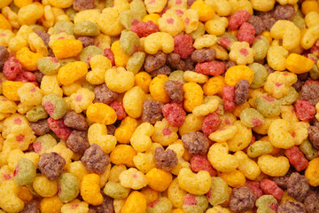 Sweet crunchy cornflakes as a background. Top view.