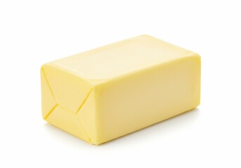 Wrapped butter block on white background, studio shot, creamy yellow color