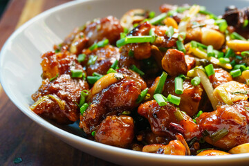 Authentic Chinese Kung Pao Chicken stir-fry with juicy chicken, peanuts, dried red chilies, and vegetables in a spicy savory sauce, traditional Sichuan recipe served in Asian restaurants worldwide
