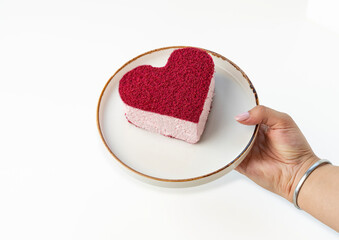  Hand Holding Heart-Shaped Cakes on a Plate for Valentine's Day or Romantic Celebration