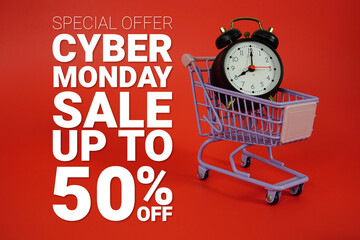 Cyber Monday Sale 50% Promotion and Marketing with trolley shopping cart and alarm clock on red...