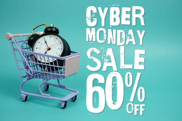 Cyber Monday Sale 60% Promotion and Marketing with trolley shopping cart and alarm clock on blue...
