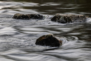 Closeup view of flowing river surface. Natur backgrounds or water texture.