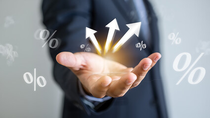 Businessman hand holding upward arrows and percent symbols growth success