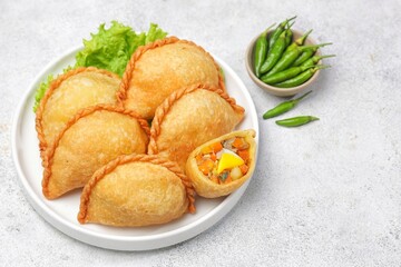 Pastel Goreng in Indonesia, pastel refers to a type of kue filled with meat, vegetables, and rice vermicelli deep fried in vegetable oil. It is consumed as a snack and commonly sold in Indonesian trad