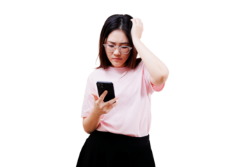 Asian young beautiful woman in a pink shirt appears puzzled while looking at her smartphone, touching her head in a moment of contemplation.