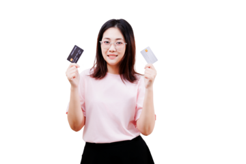 Asian young beautiful woman with glasses holds two credit cards, smiling confidently while dressed in a pink shirt.
