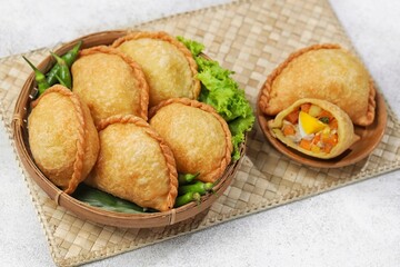 Pastel Goreng in Indonesia, pastel refers to a type of kue filled with meat, vegetables, and rice vermicelli deep fried in vegetable oil. It is consumed as a snack and commonly sold in Indonesian trad