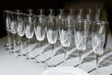 A lot of different glasses on the table.