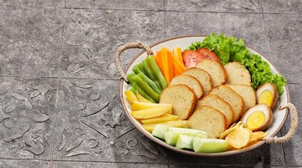 Selat Galantin is known for its combination of savory, sweet, and fresh flavors from its distinctive sauce, served with chicken or beef galantin.