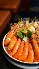 Delicious grilled prawns with lemon and salad served on a plate for a healthy seafood meal