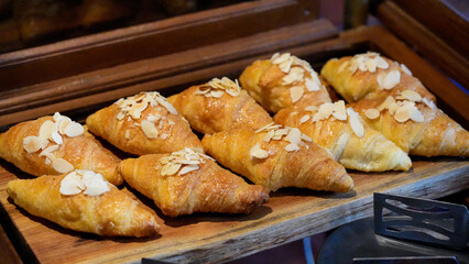Fresh baked croissants and sweet homemade cookies on a plate are a delicious breakfast pastry