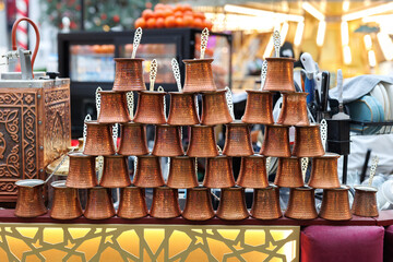 Traditional Turkish coffeepot made of copper , handcraft turkish coffee pot on souvenir shop.