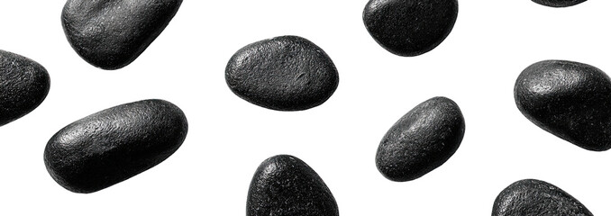 Scattered dark gray stones against a black background